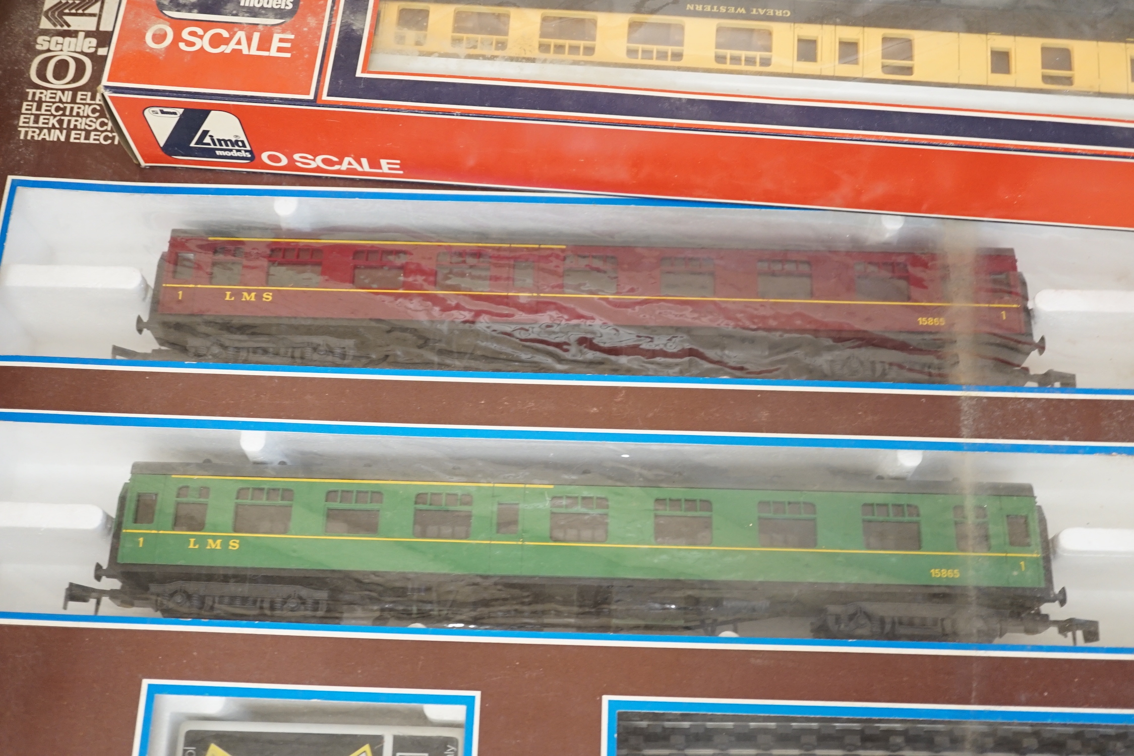 A Lima 0 gauge battery operated train set, together with two additional boxed coaches and a boxed container wagon